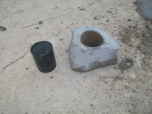 Whinstone cylinder and the rock from which it was cut