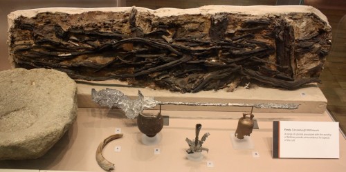 A selection of Carrawburgh finds are on display. These include a portion of the wattle and daub, made by a woven lattice of wooden strips being daubed with a sticky material (usually made of some combination of wet soil, clay, sand, animal dung and straw). Below is an iron shovel which would have been used by Lion-grade members to tend the sacred flame.