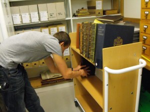 Volunteers help to reshelve library books