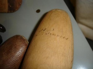the wooden last with ink writing on