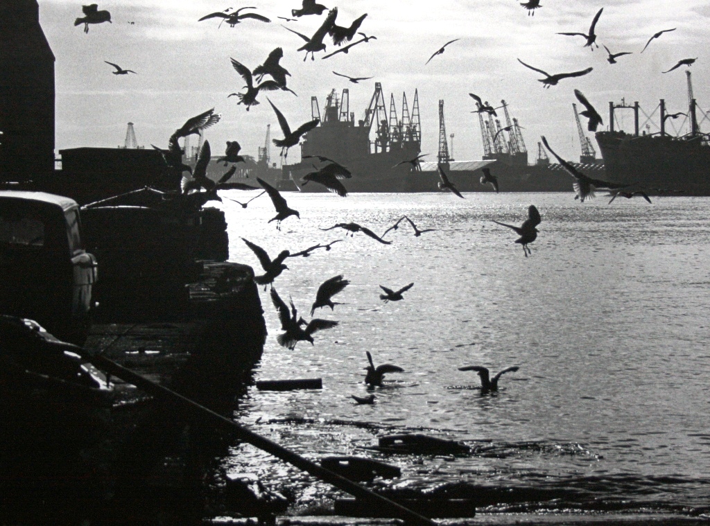 industrial scene of the River Tyne, with cranes and ships in dock, 1970s