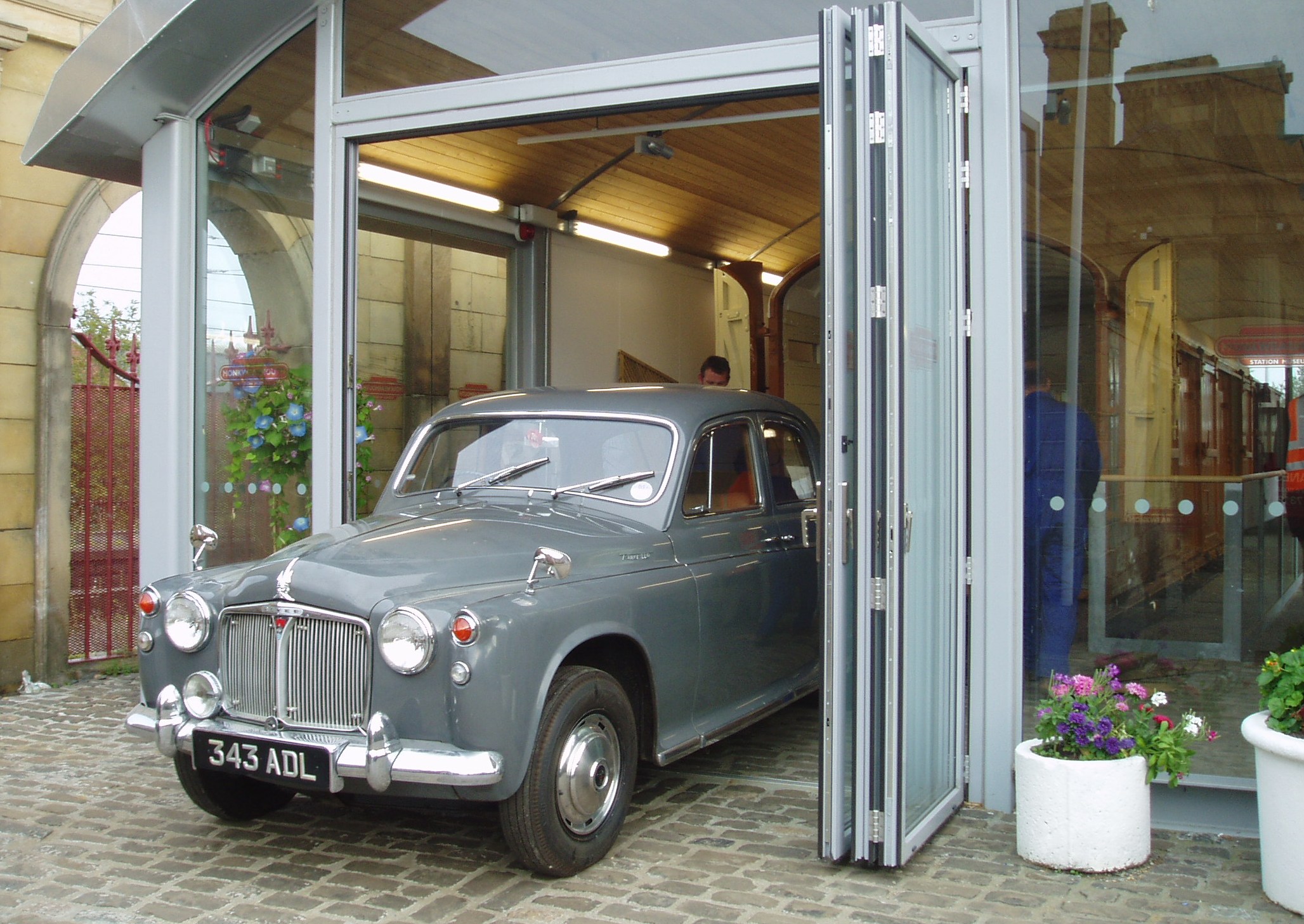 After checking its condition the car is pushed to the ramp through the folding doors that were designed into the building with this type of operation in mind.