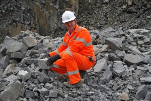 Quarry manager Peter Scott selecting pieces of whinstone