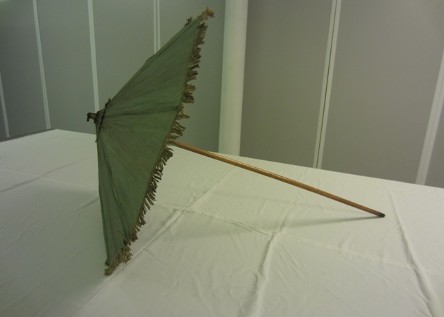 Walking stick parasol covered in green silk trimmed with a short silk fringe, 1770s – 1800s. TWCMS: J1383