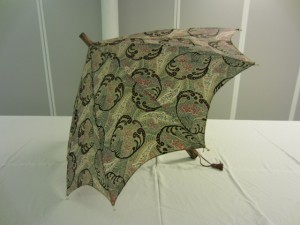 This parasol is the latest in the Collection, dating 1910-1925. It is labelled ‘British Make’.  TWCMS: J1387