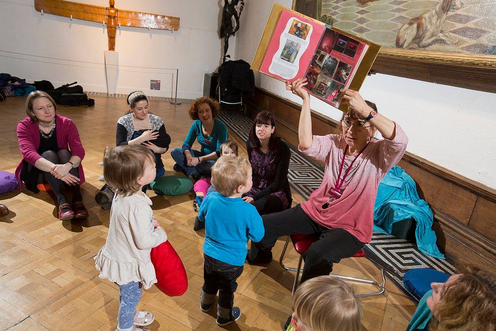 Claudia sharing the Exhibition Explorers Encyclopedia with the children - photo: Mark Savage