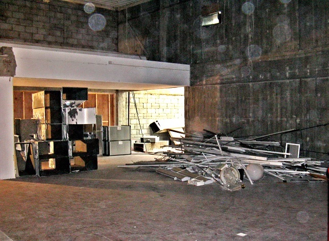 Interior building site - wooden floor plus debris with background doorway